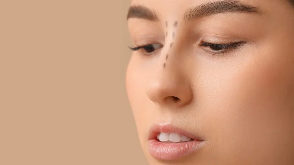An individual with a marked nose treatment area.