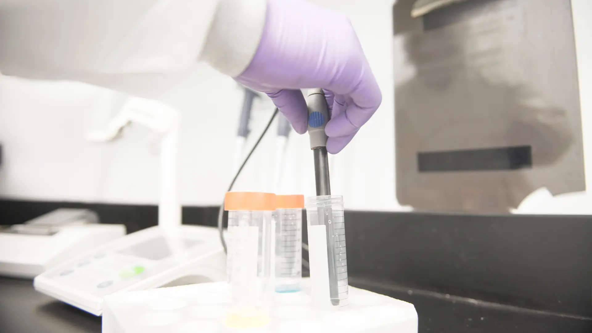 A medical expert working with formulations in a laboratory.