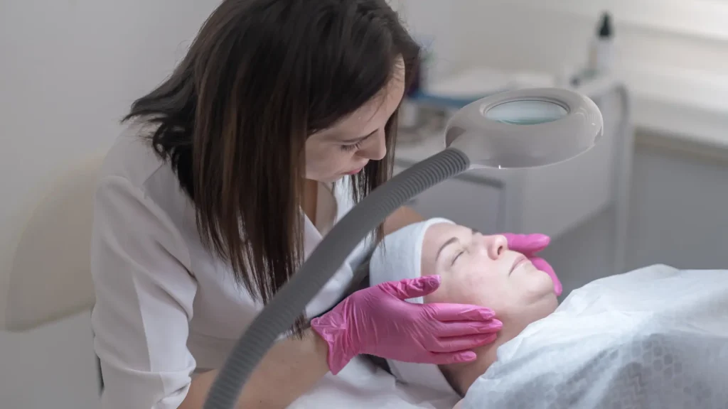 A medical professional examining the patient's skin and concerns.