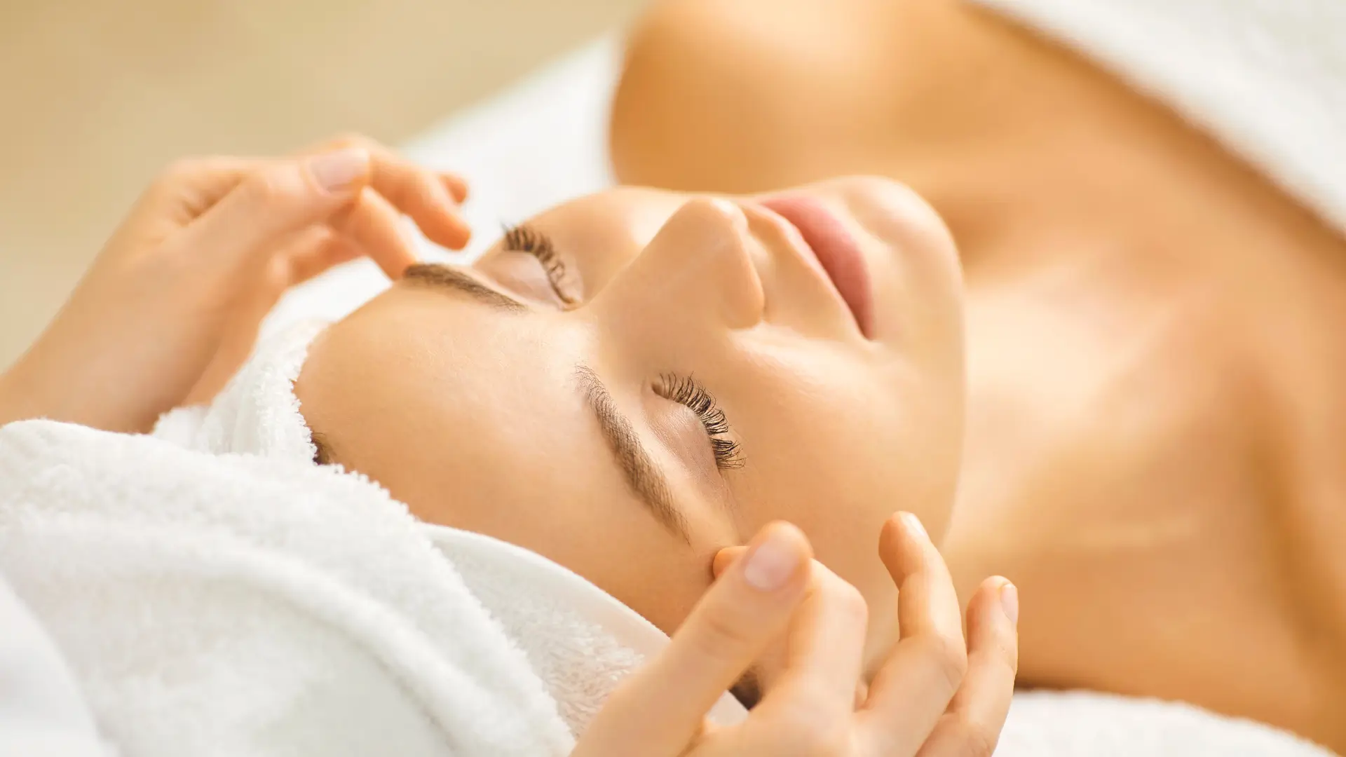 An individual undergoing a facial skincare treatment.