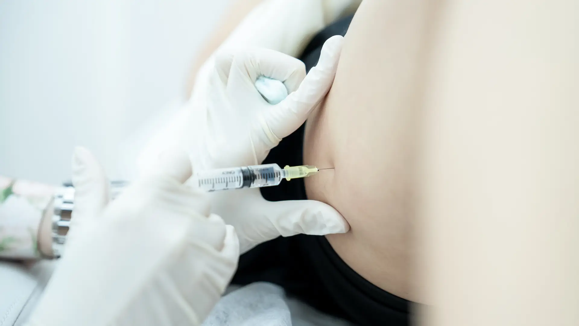 An individual undergoing an injection treatment for their cellulite.