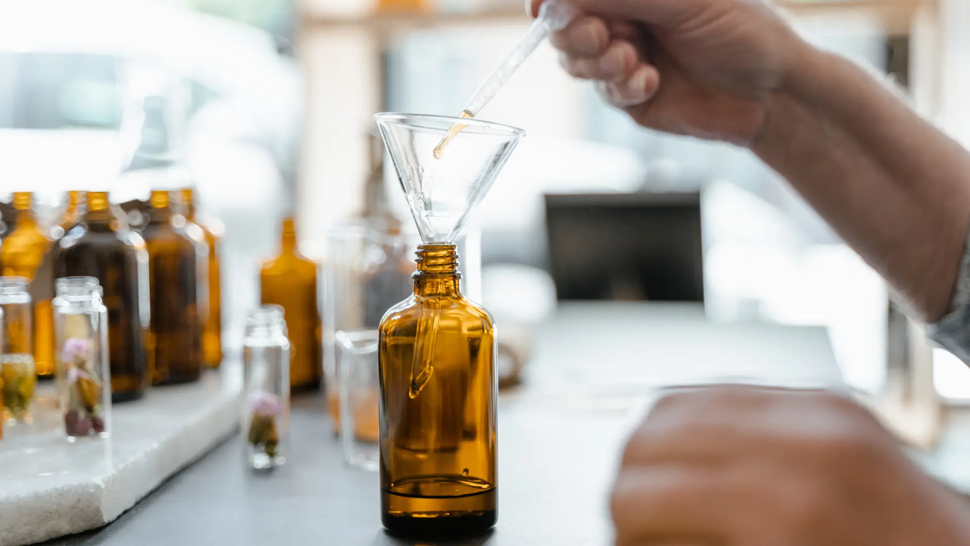 A scientist working a formulation in a laboratory.