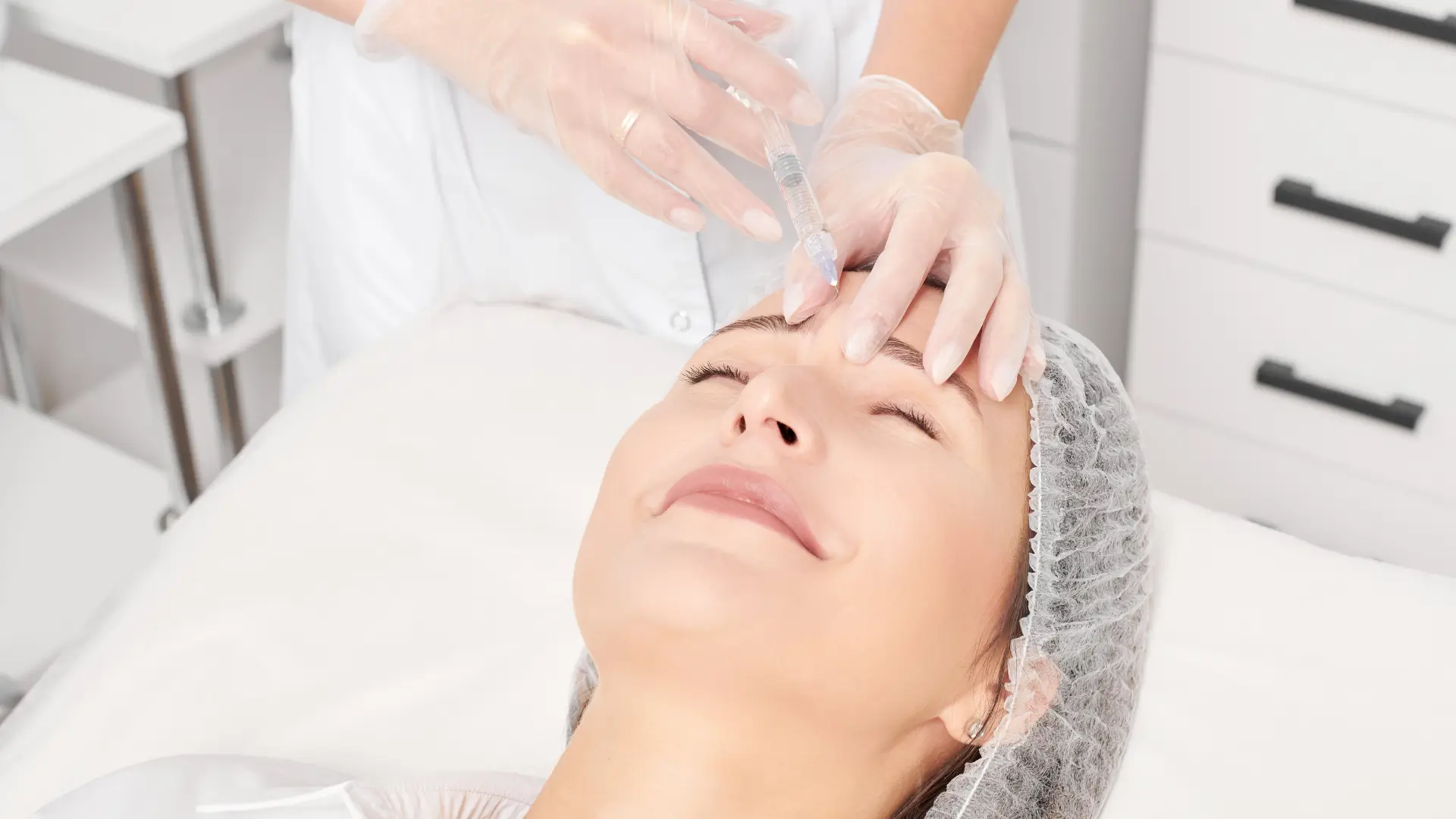 A patient undergoing a facial rejuvenation injection treatment.