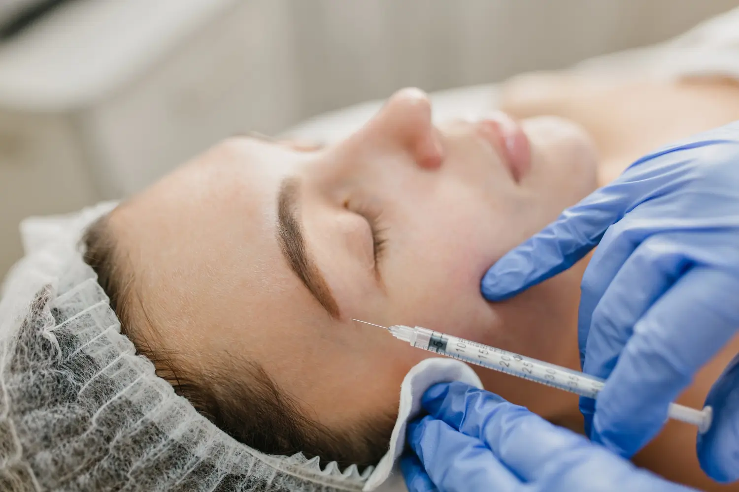 A patient receiving a rejuvenation injection for their face.
