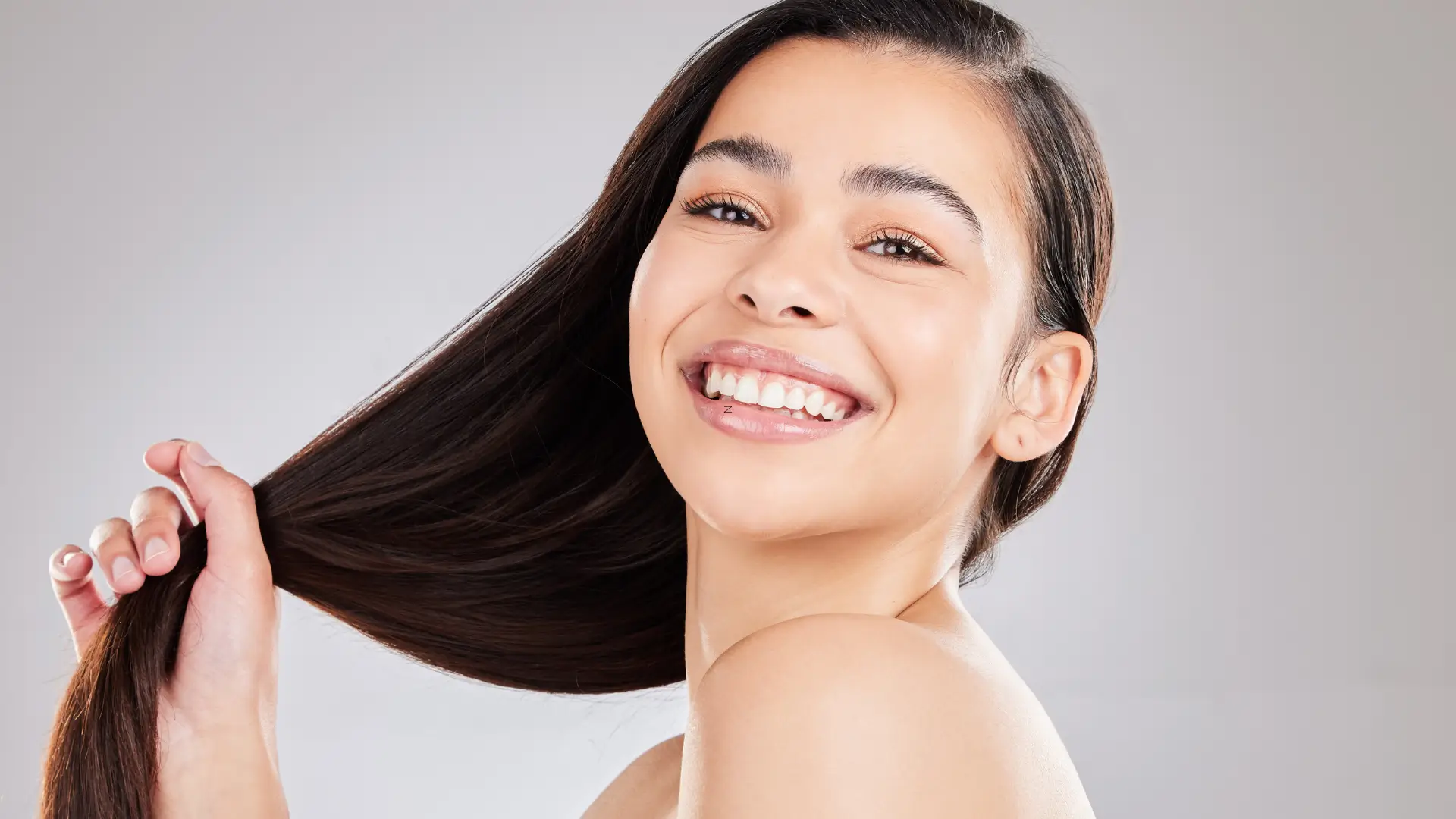 An individual showing off their healthy, long hair.