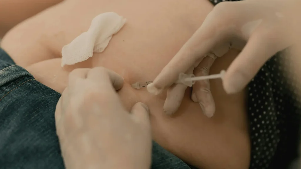 An individual undergoing an injection treatment.