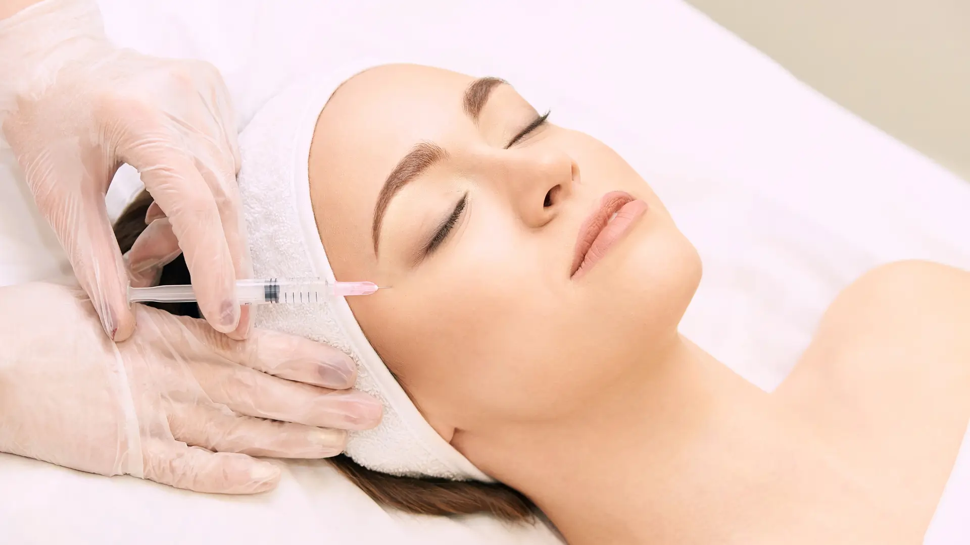 An individual undergoing a mesotherapy injection treatment.