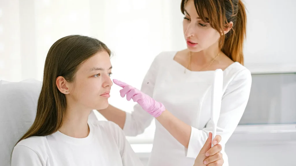 An individual having a consultation with their trusted dermatologist.