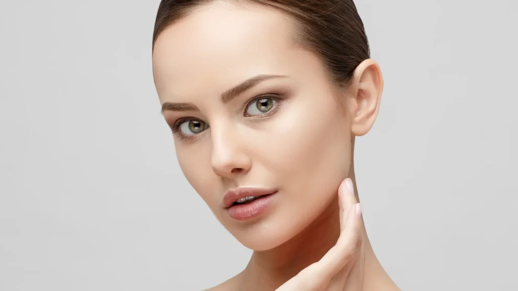 An individual with clear and smooth facial skin.