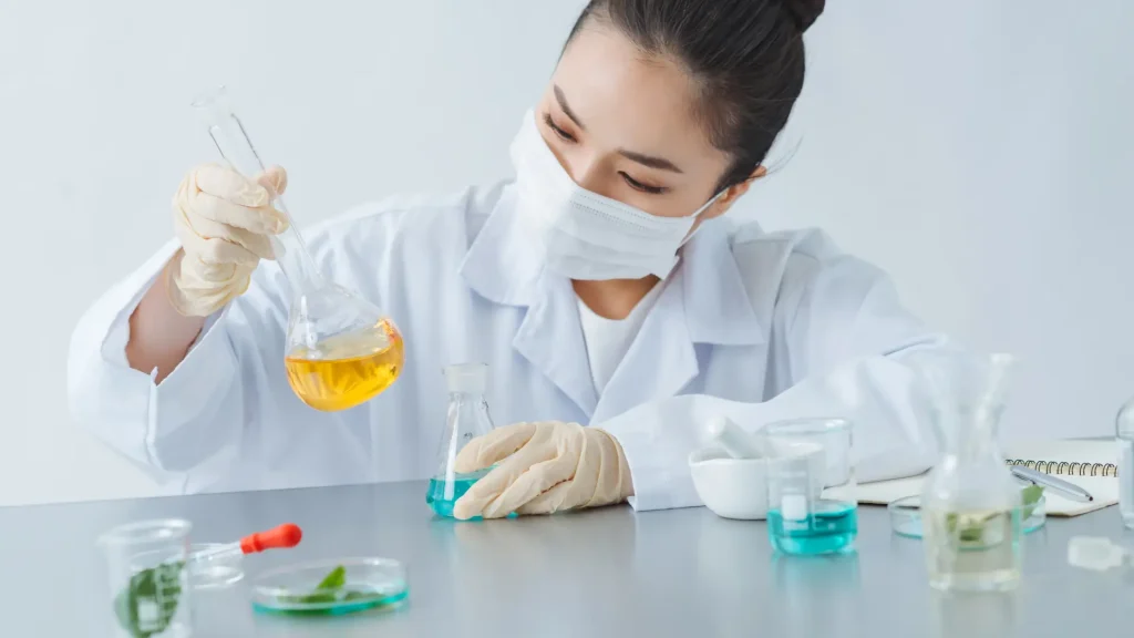 A scientist working with various ingredients and substances.