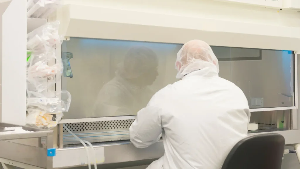 A pharmaceutical scientist working in a laboratory.