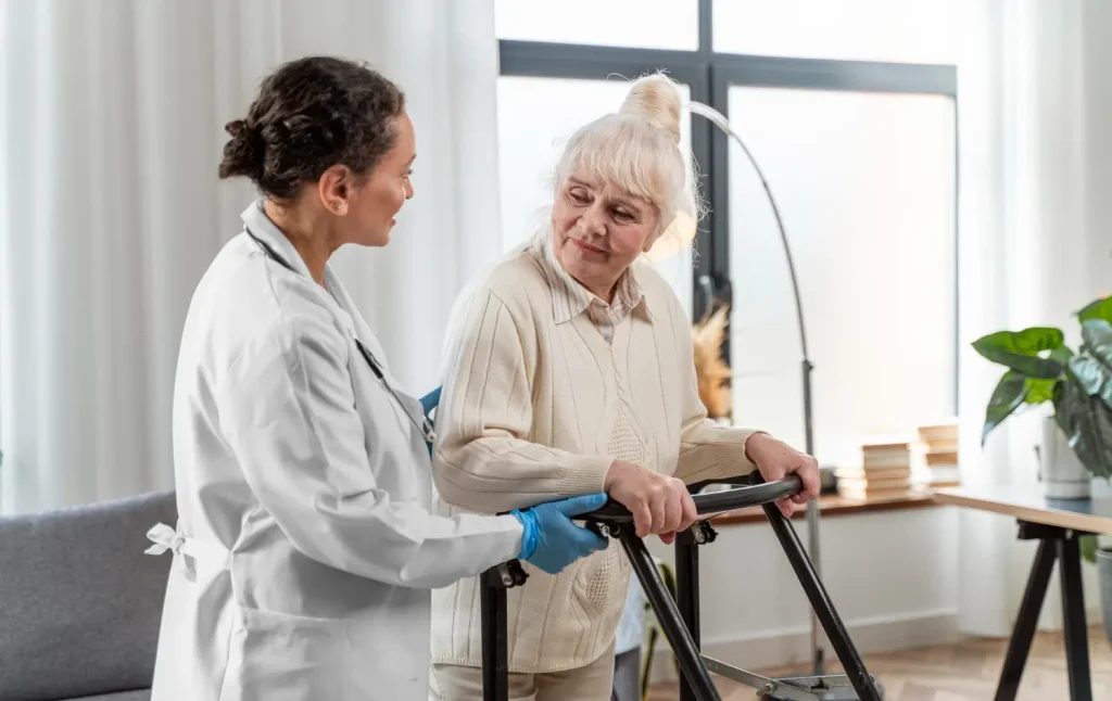 An older woman during an assessment with a medical professional for their osteoporosis treatment.