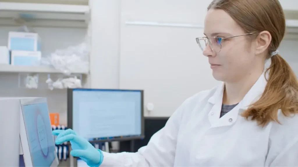 A scientist working and using the laboratory equipment.