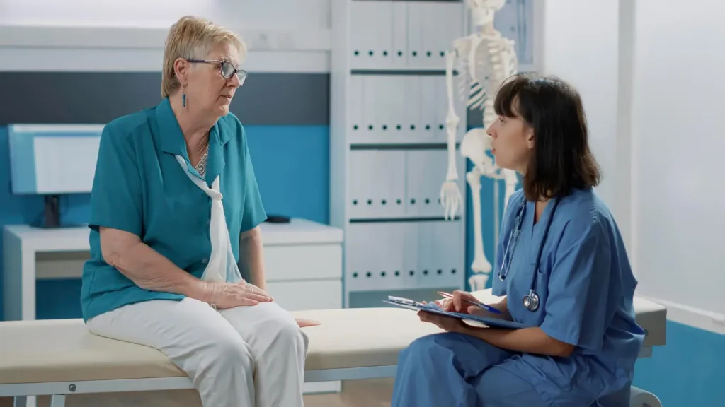 A doctor and older patient consultation and assessment.