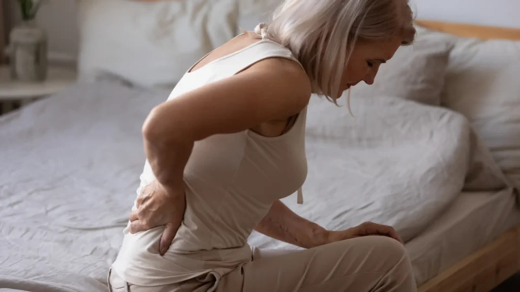 An older individual dealing with back pain.