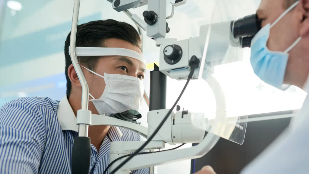 A doctor measuring a patient's intraocular pressure.