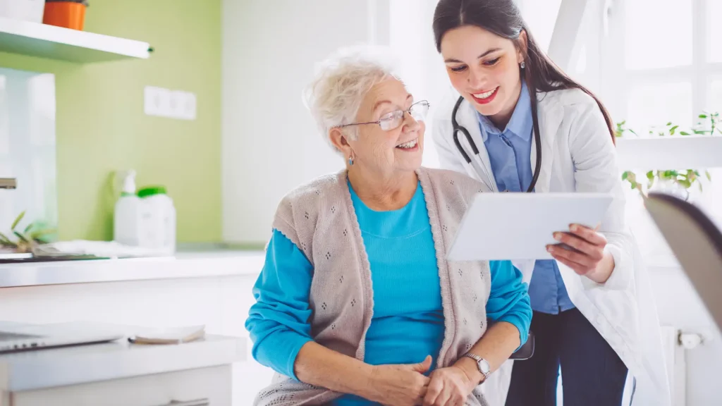 An older individual and doctor during a consultation.