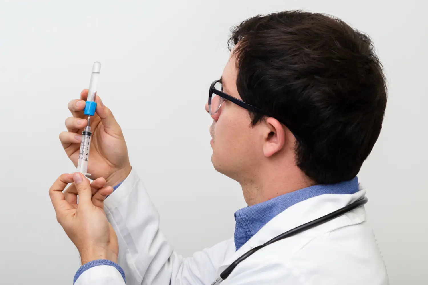 A medical professional measuring the right dose.