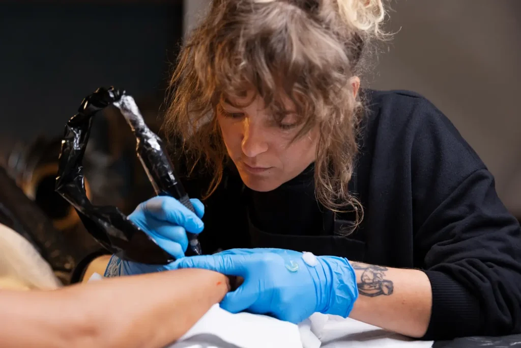 A client undergoing a tattooing session.