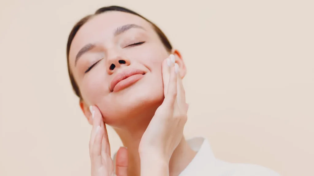 An individual showing off their smooth, healthy facial skin.