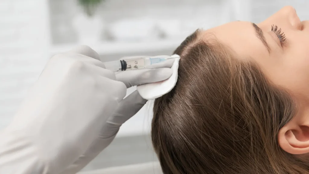 A patient receiving a hair restoration treatment.