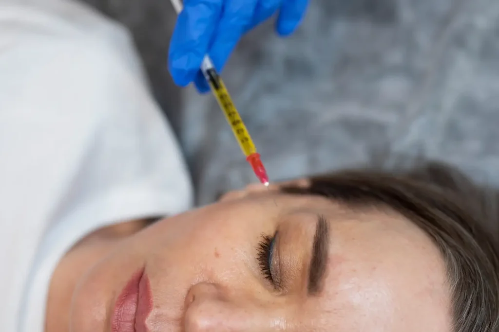 An individual receiving a PRP face treatment.