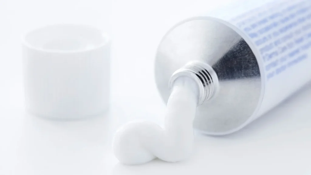 A close-up shot of topical medicine cream from a tube.