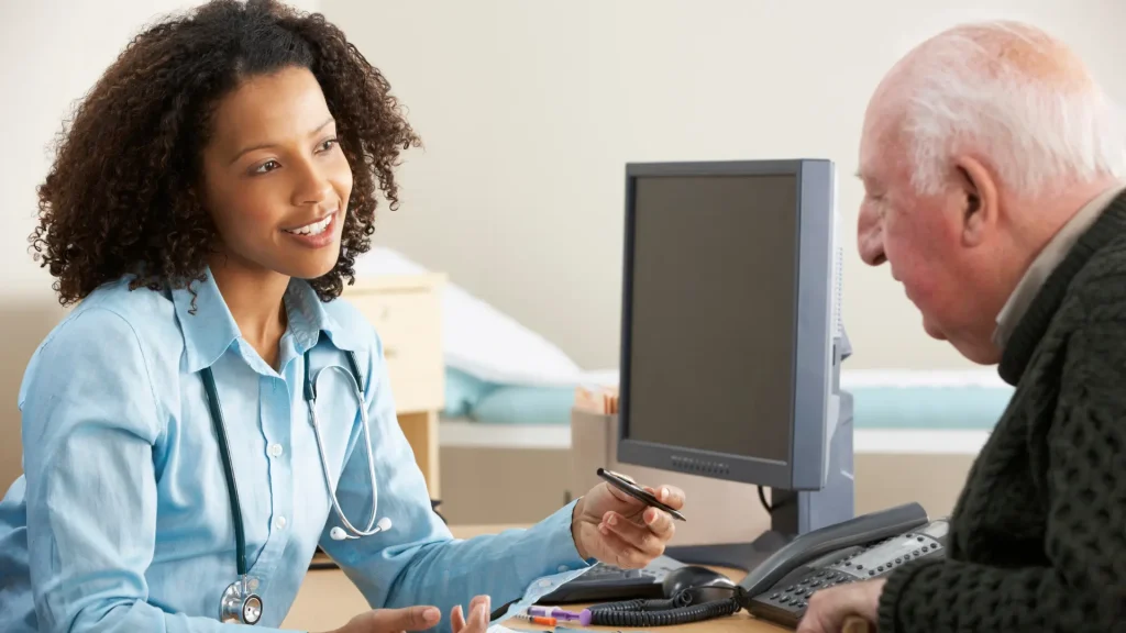 A doctor and older patient consultation.