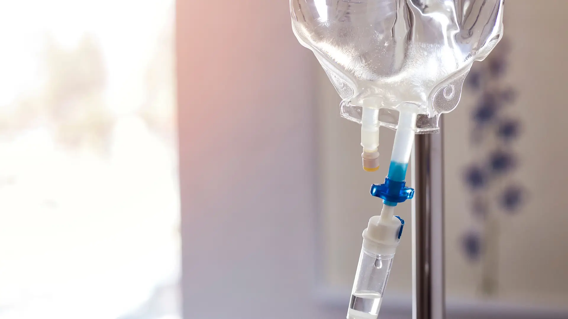 A close-up shot of an intravenous drip in a hospital.