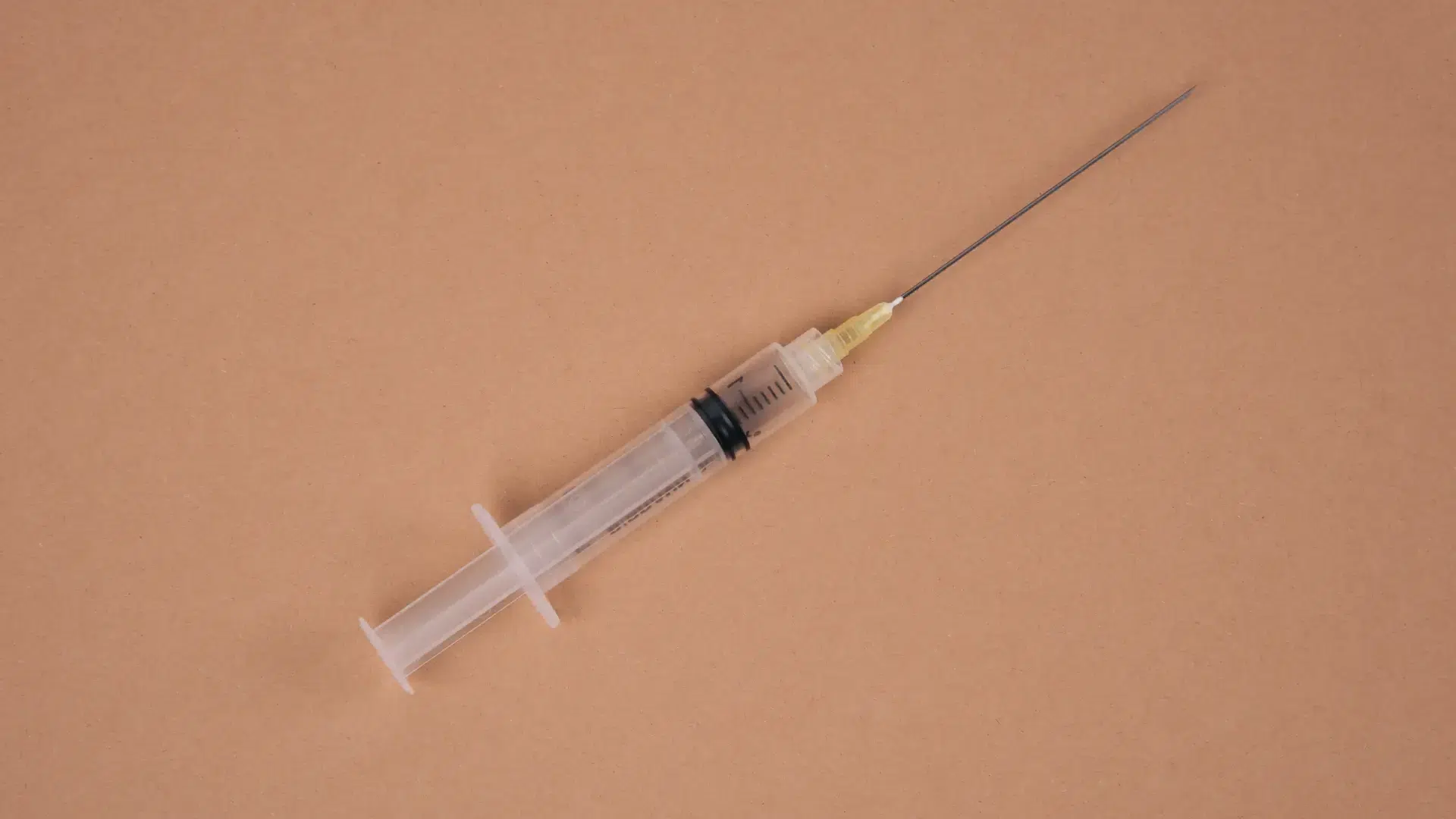 A contraceptive injection on a surface.