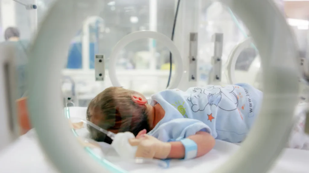 A newborn in a hospital room.