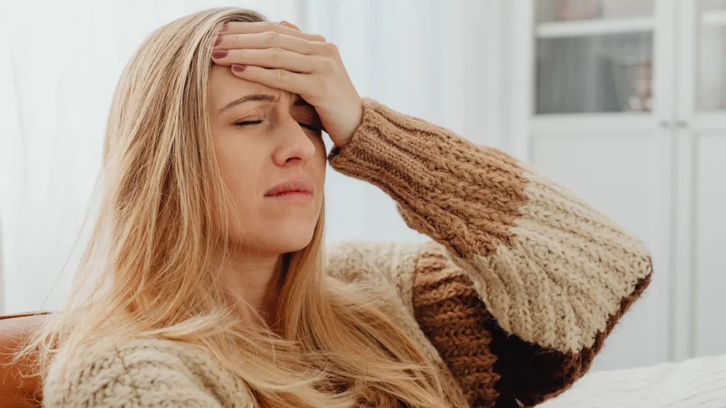 An individual dealing with a headache.