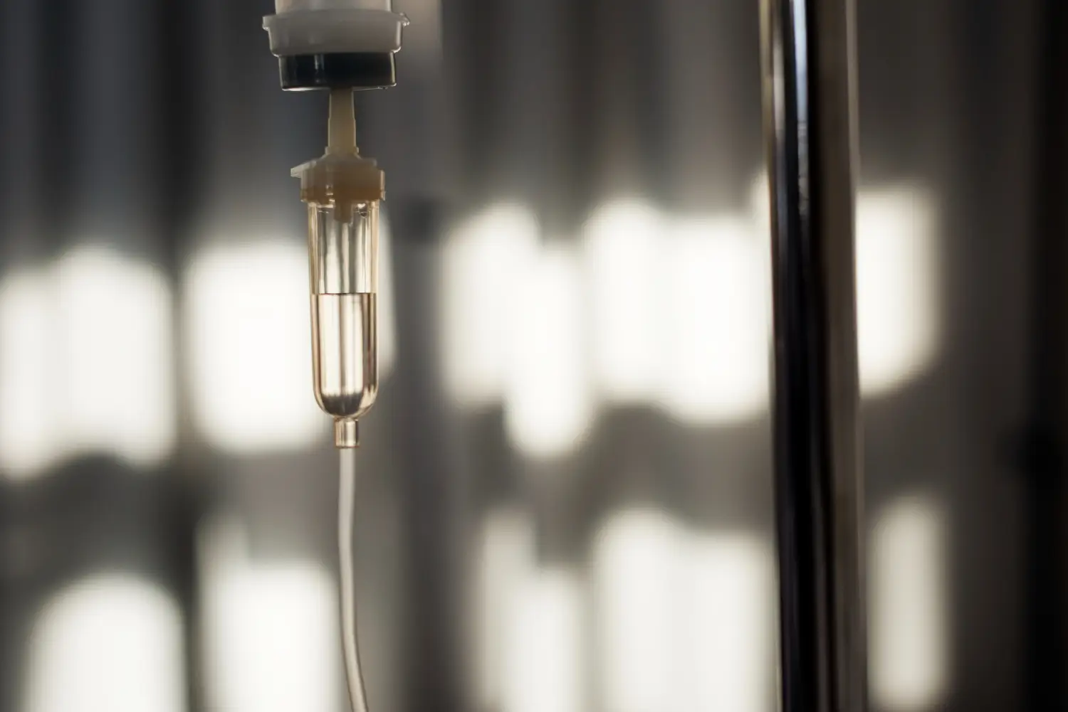 A closeup shot of an IV drip chamber.
