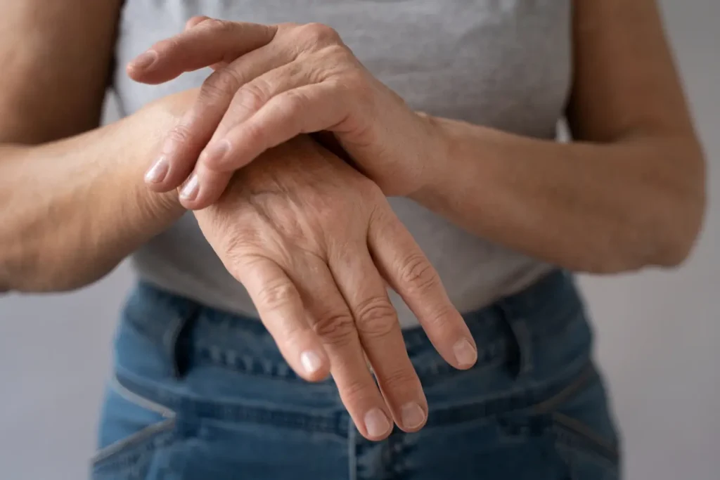 An older individual dealing with rheumatoid arthritis.