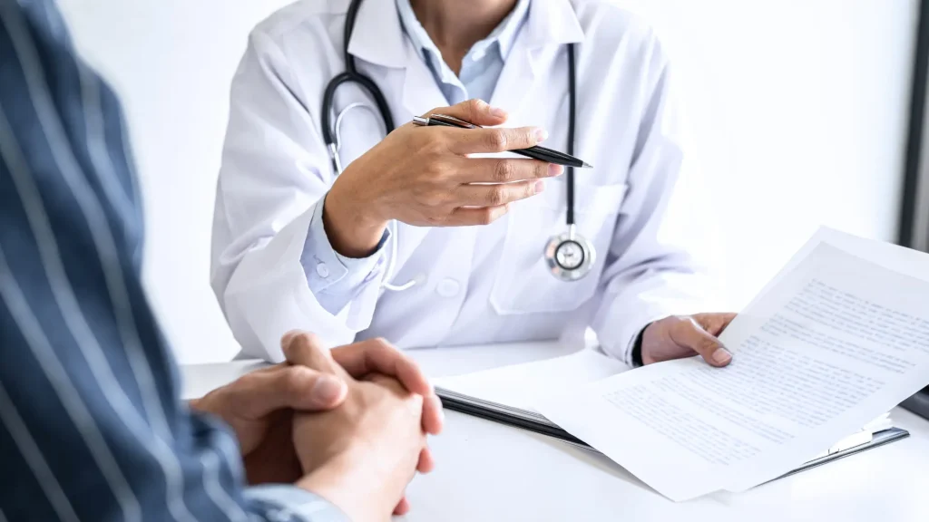 A doctor explaining the official prescribing information label of a medication to a patient.