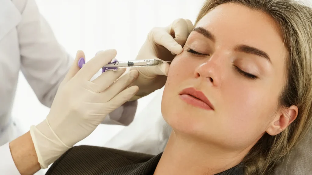 An individual receiving a facial injection.