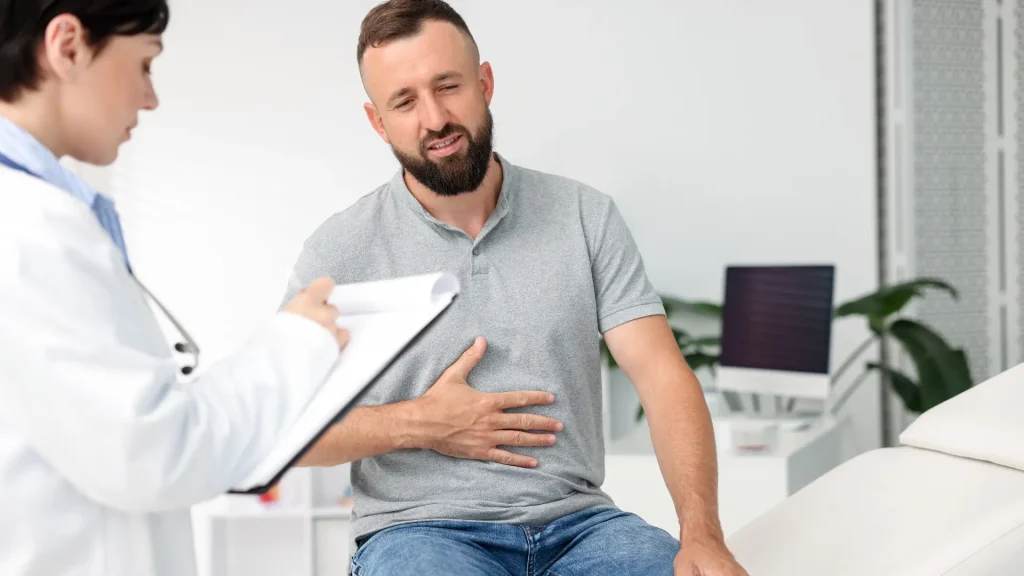 A male patient consulting their doctor about the gastrointestinal concerns that are possible effects of semaglutide or Ozempic injections.