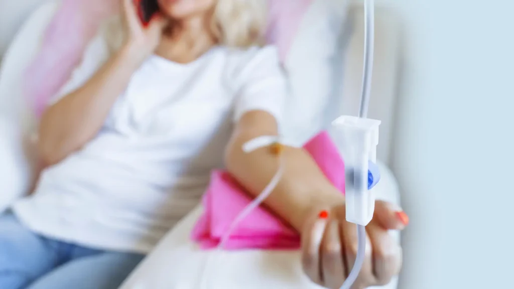 An individual undergoing an IV infusion session.