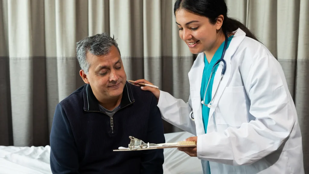 A doctor happily showing the results of laboratory or treatment progress to patient.