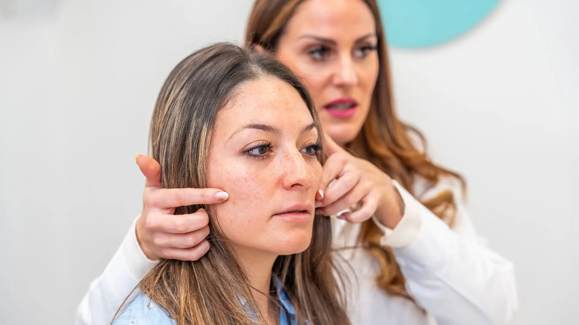 A patient undergoing a skin evaluation with a dermatologist.