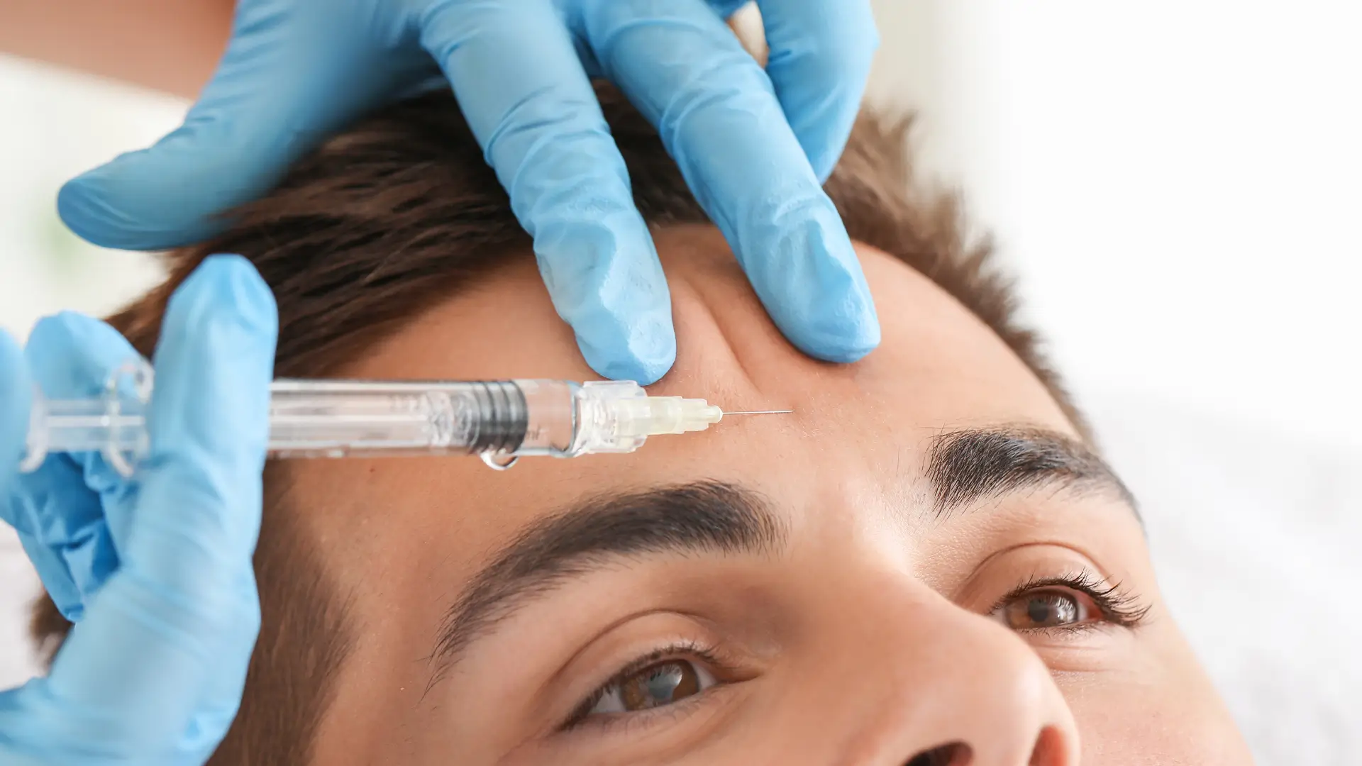 A male individual receiving an injection for their '11' lines.