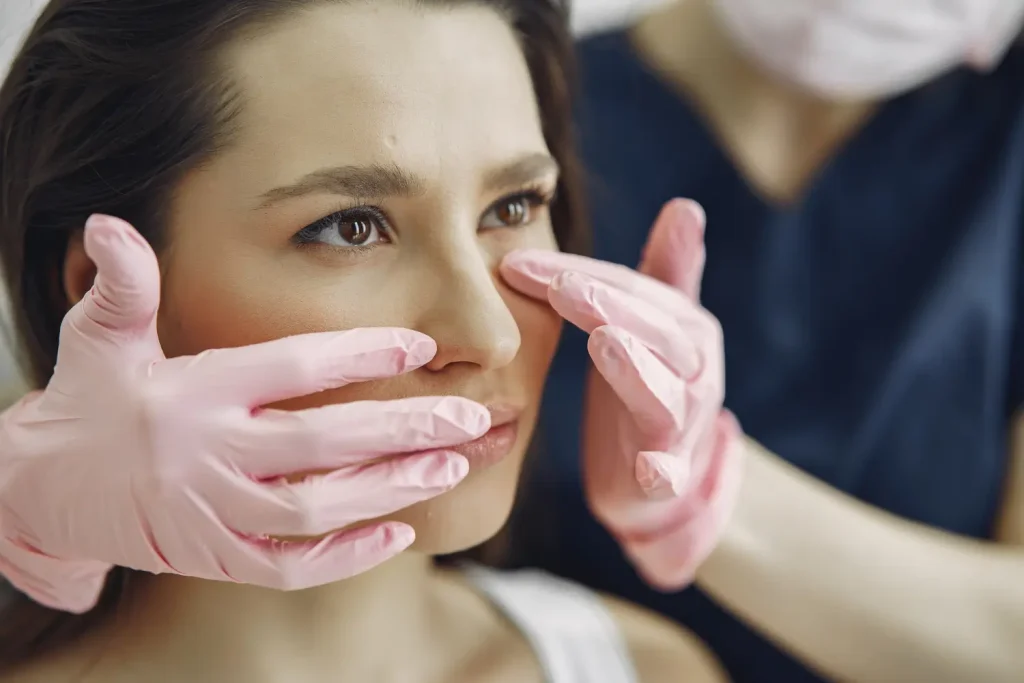 An individual undergoing a consultation with an aesthetic professional.