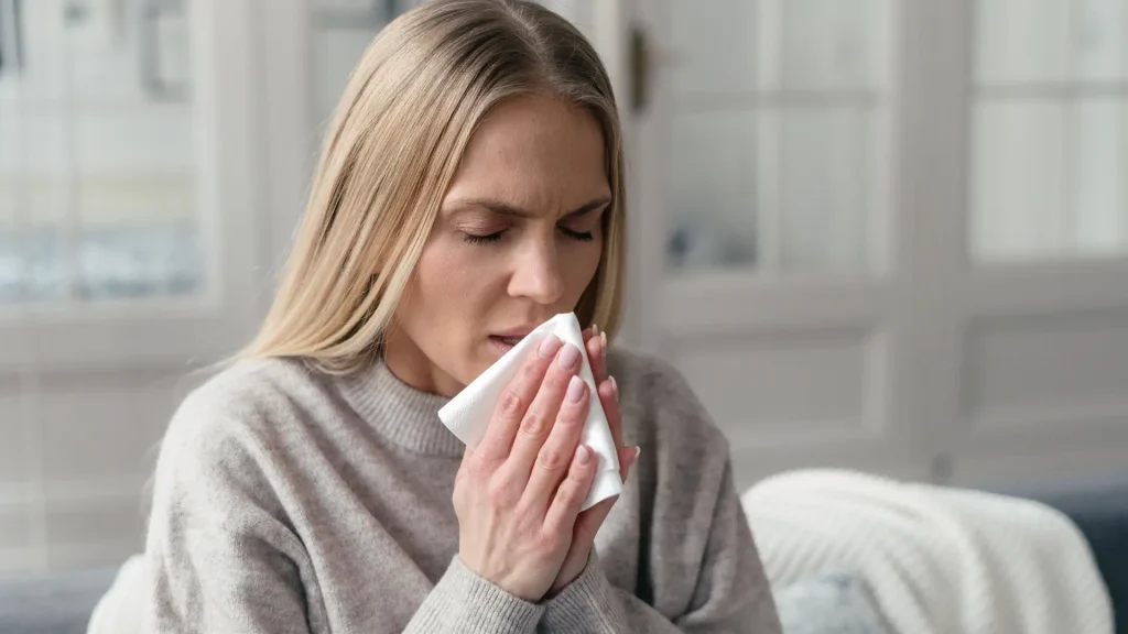 An individual suffering from a sinus discomfort.