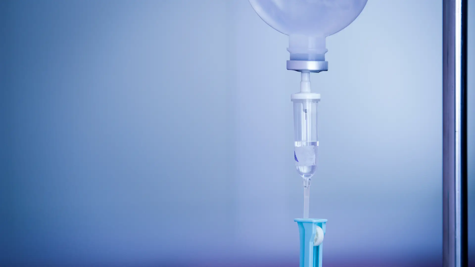 A close-up shot of an IV fluid drip.