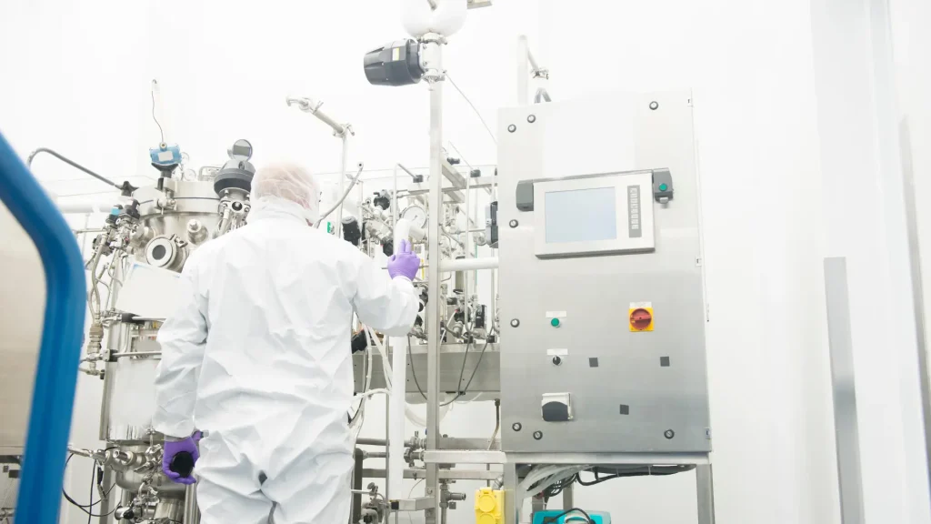 A scientist working in a pharmaceutical laboratory.