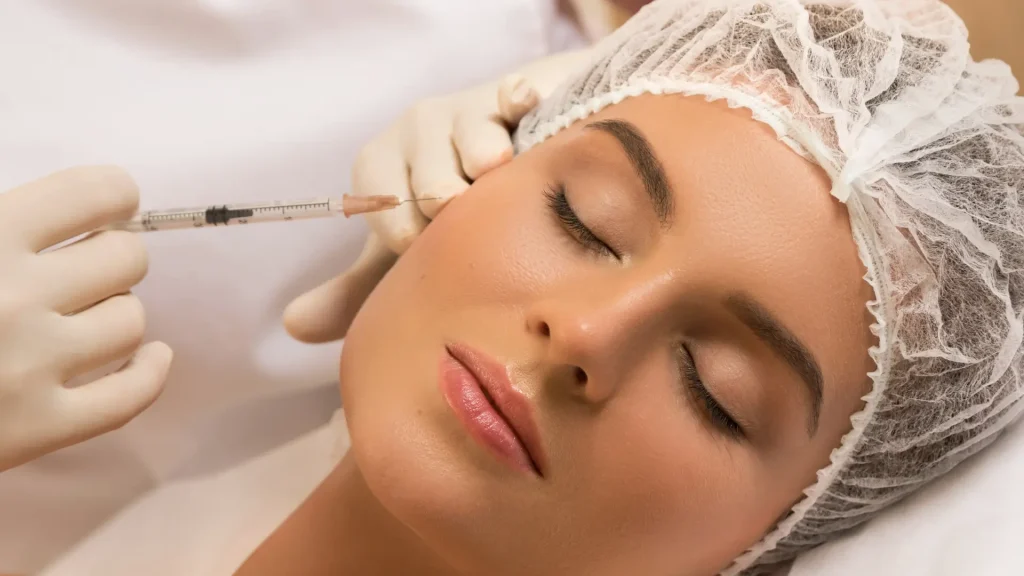 An individual receiving a facial injection.