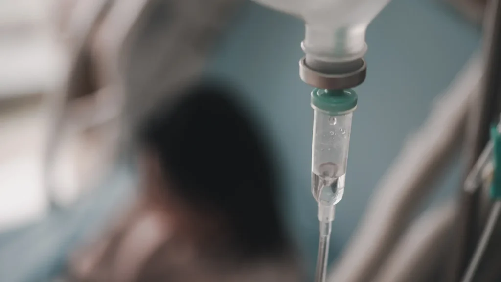 A close-up shot of a patient's IV drip medication.