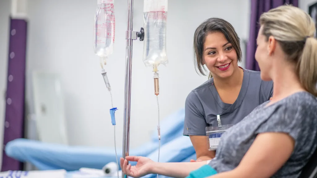 An individual receiving an IV drip treatment.
