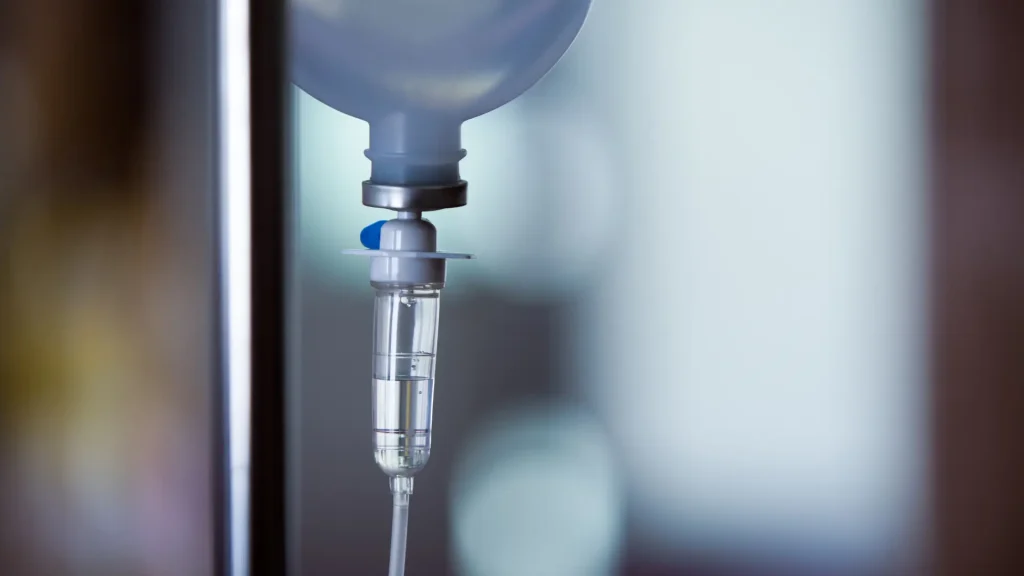 A close-up shot of a medical IV fluid.