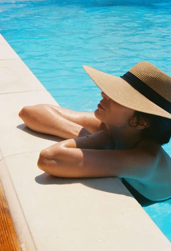 woman by pool summer